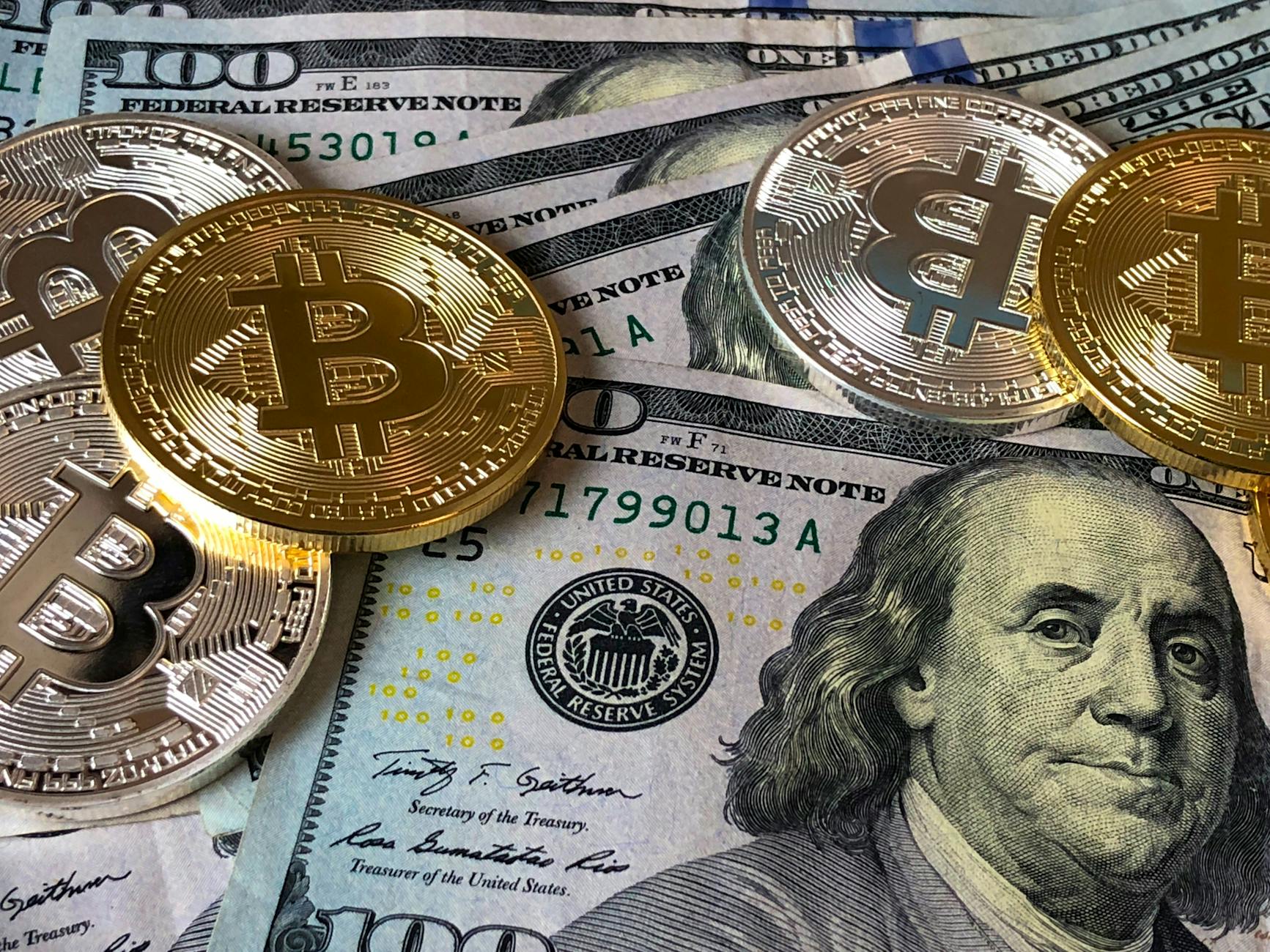 Bitcoins and U.S. Dollar Bills